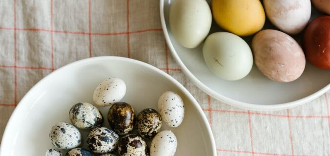 colorful eggs placed on plates on table