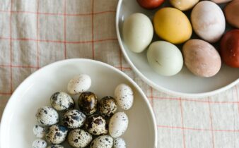 colorful eggs placed on plates on table